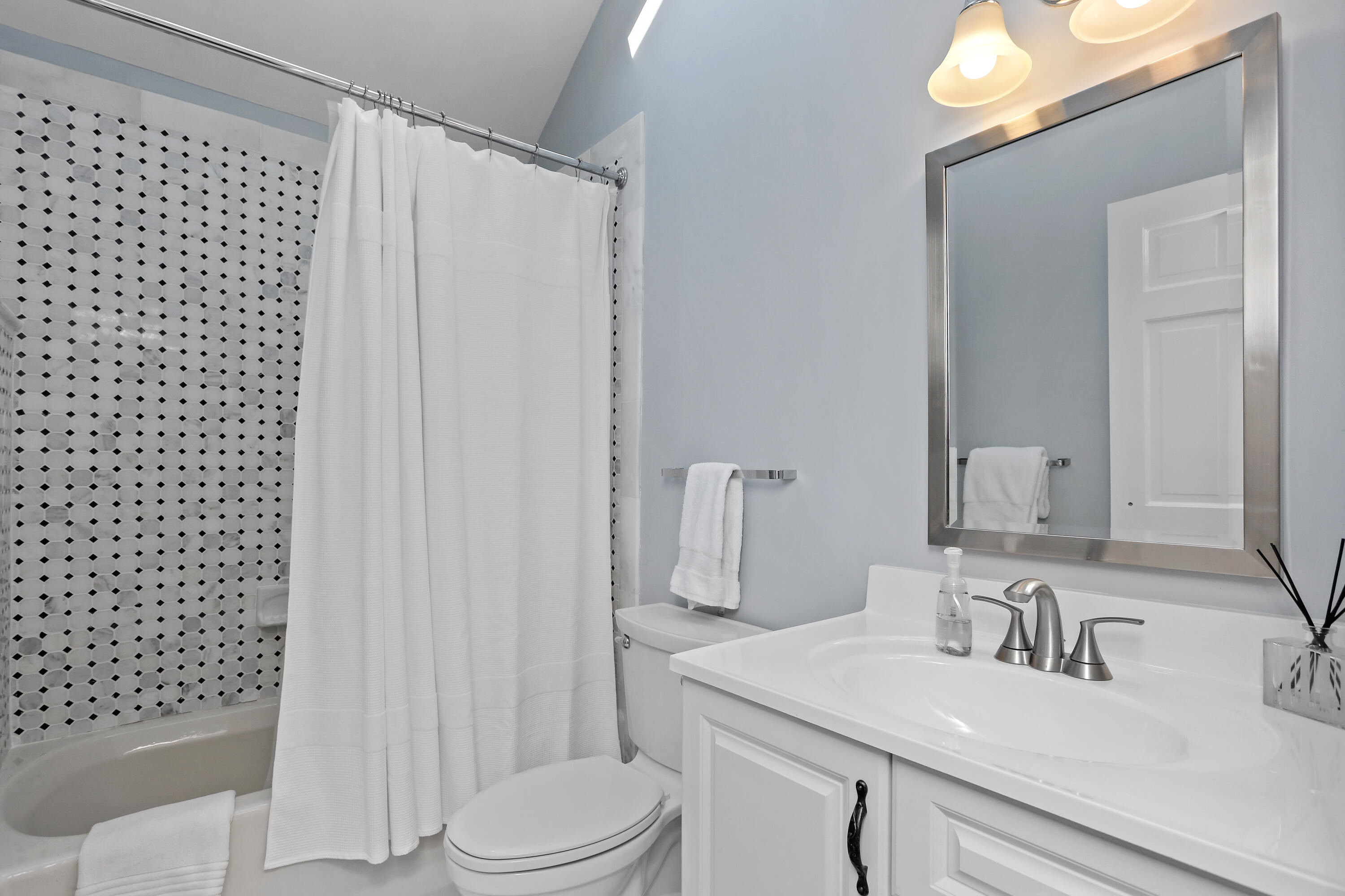 8 Beach Drive Darien, CT 06820 - Photo 24 of 27 a bathroom with a sink a toilet and shower