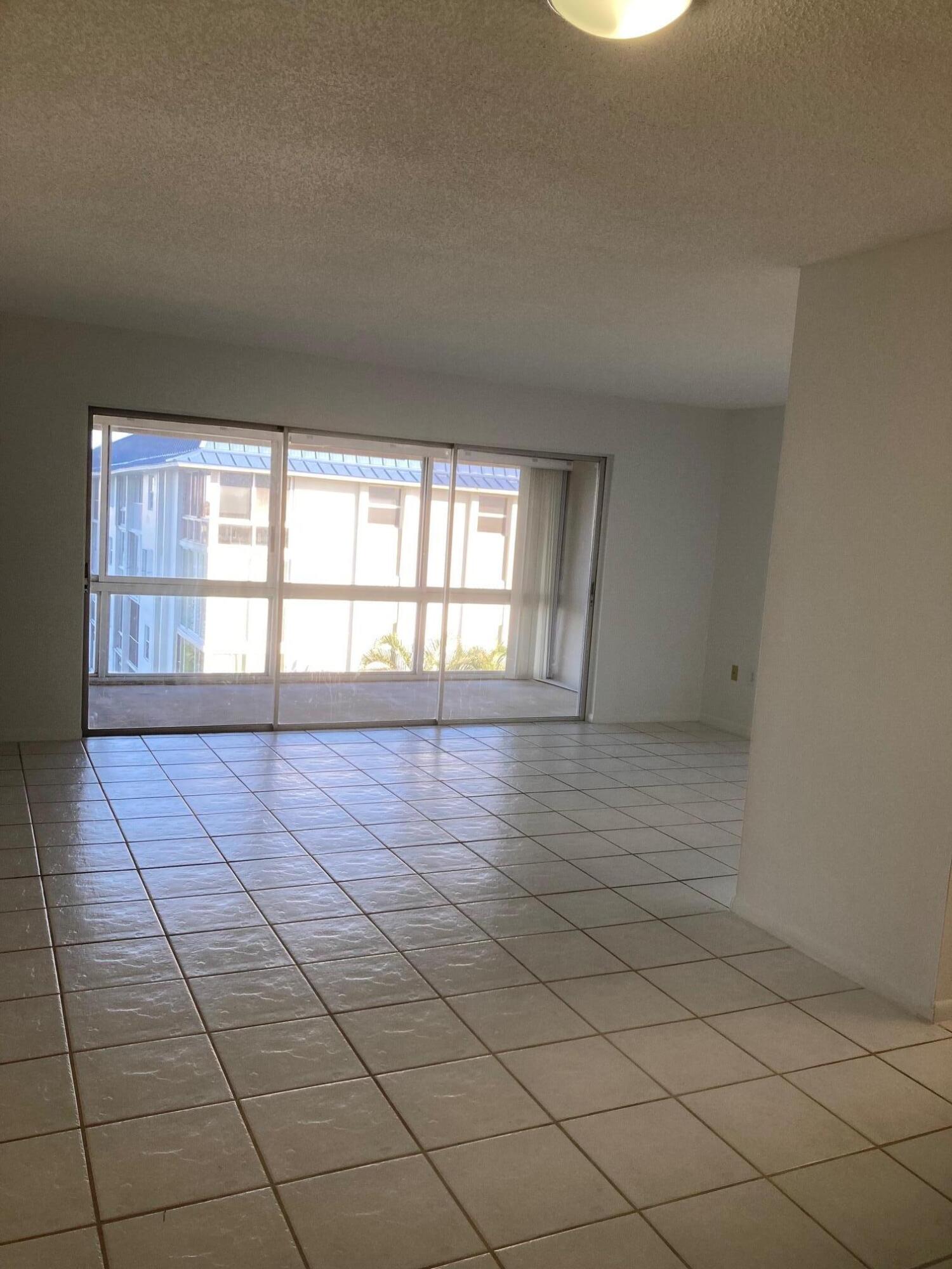 2936 Lake Shore Drive, Unit 409 Riviera Beach, FL 33404 - Photo 3 of 10 Living/Dining Area