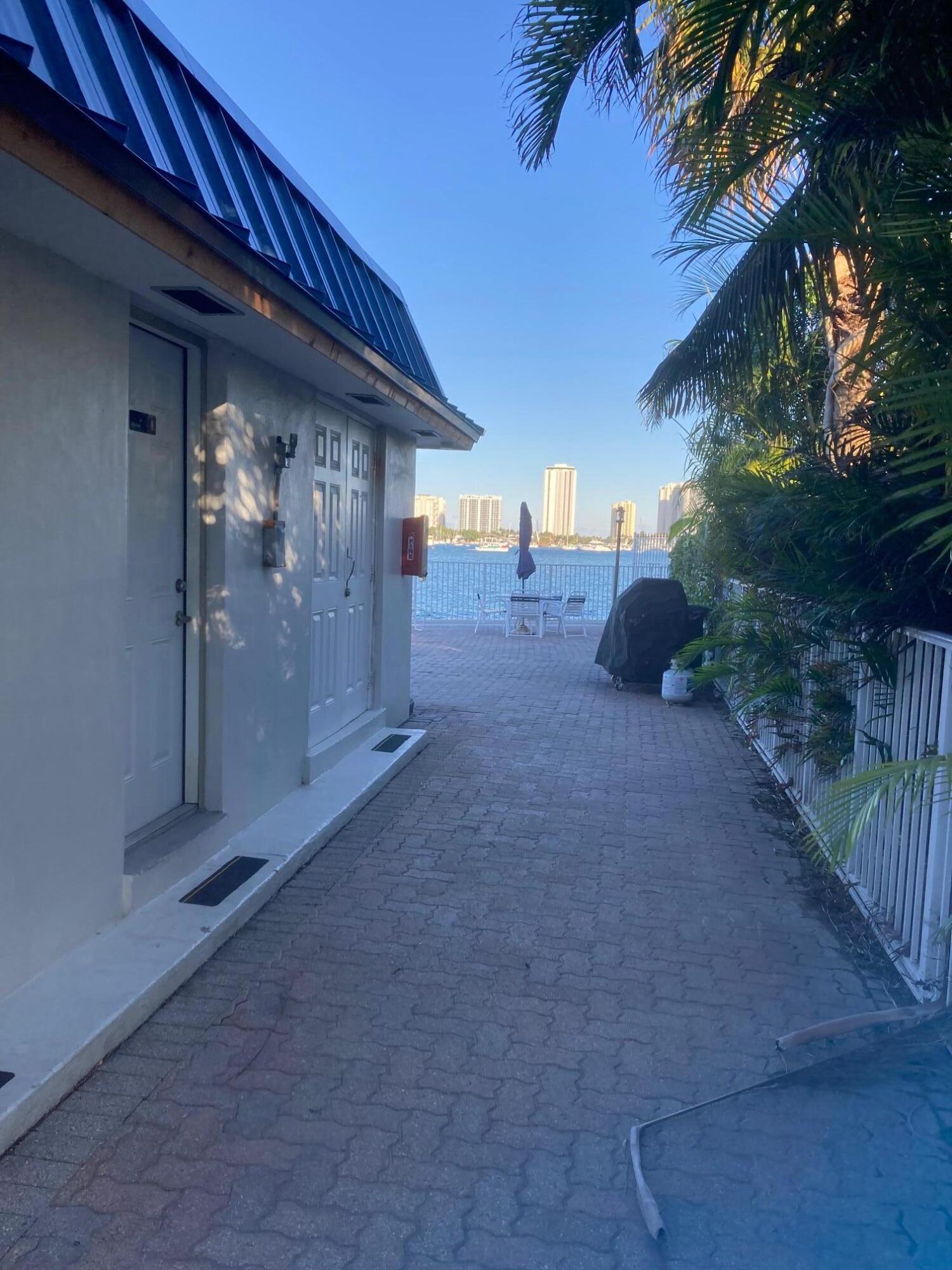 2936 Lake Shore Drive, Unit 409 Riviera Beach, FL 33404 - Photo 9 of 10 Community/Pool Area