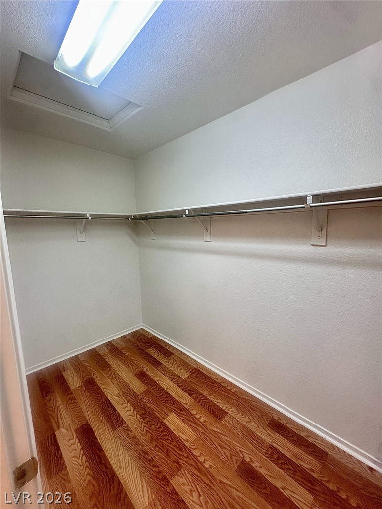 2053 Turquoise Ridge Street, Unit 202 Las Vegas, NV 89117 - Photo 8 of 18 Gleaming wood flooring complements the generous storage space in this walk-in closet.