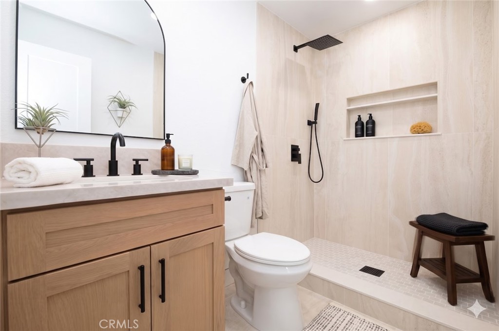 6940 Keating Drive Riverside, CA 92503 - Photo 9 of 15 a bathroom with a sink a toilet and shower