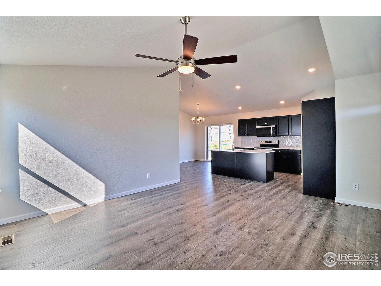 4301 Rockcress Road Evans, CO 80620 - Photo 4 of 26 a view of kitchen with wooden floor