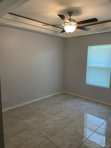 a vase of flowers sitting on a shelf
