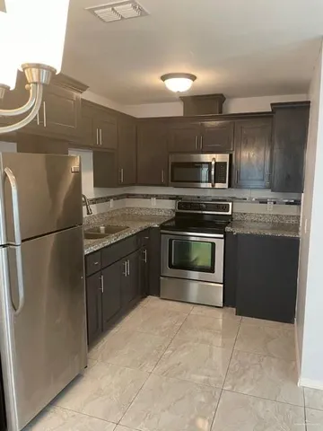 a view of a dining room with furniture and window