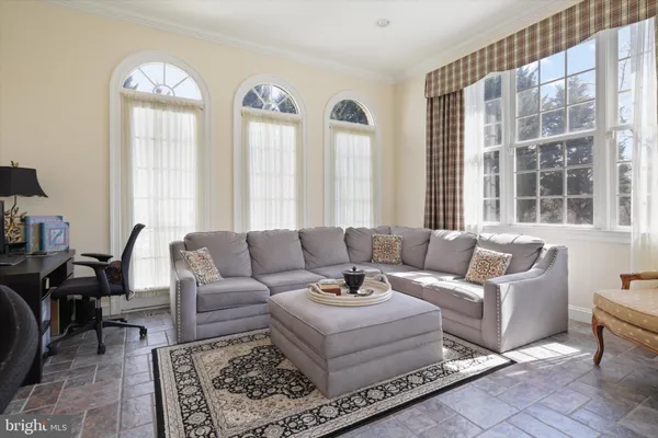 a kitchen with sink and view living room