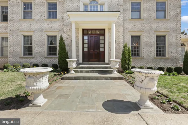 a bedroom with a bed gym equipment and a large window