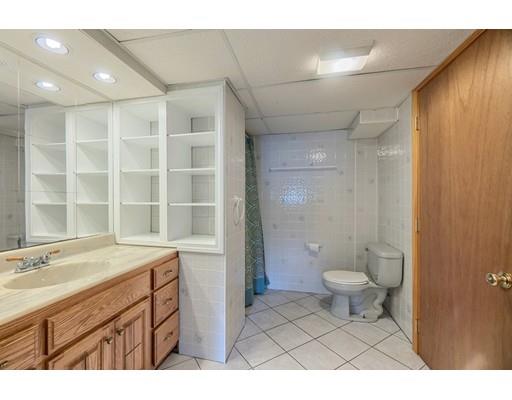 37 Governor Fuller Road Billerica, MA 01821 - Photo 23 of 27 a bathroom with a sink a toilet a shower and a mirror
