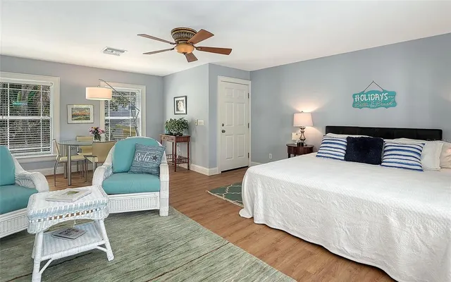 a backyard of a house with table and chairs