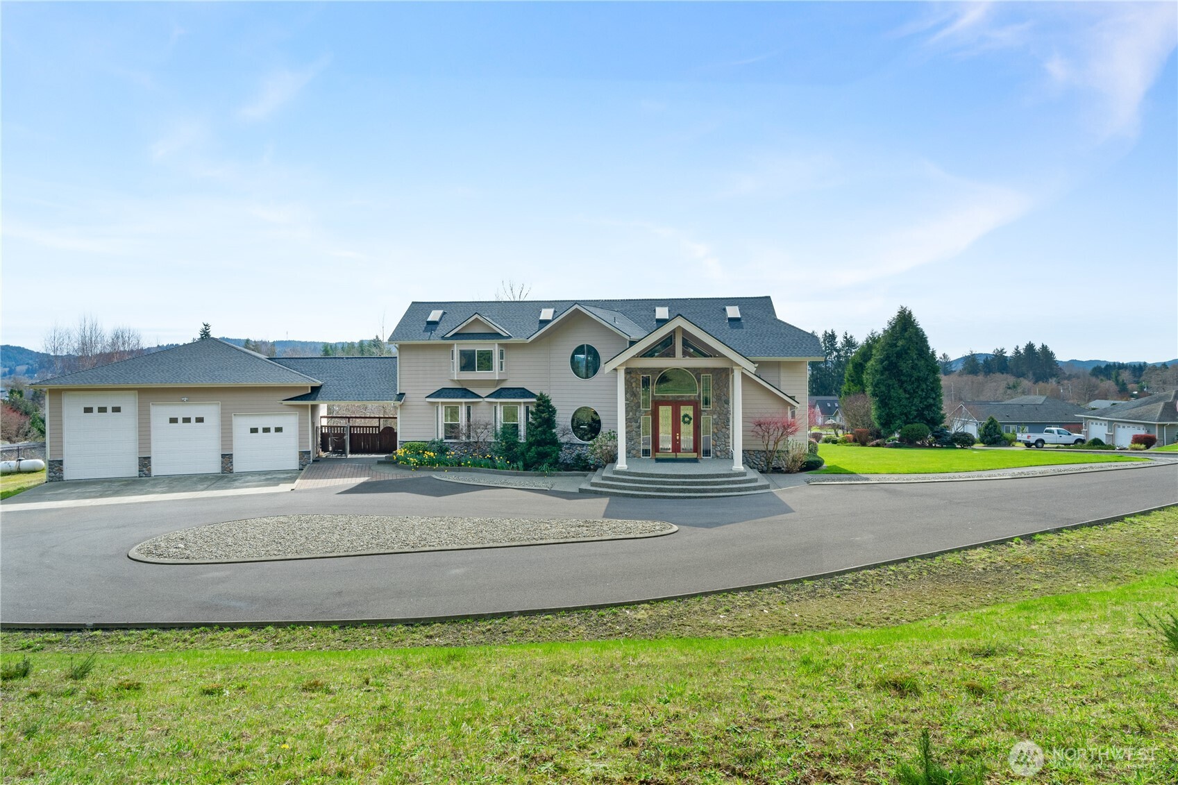 100 9th Street South Montesano, WA 98563 - Photo 1 of 40 a front view of a house with a yard and garage