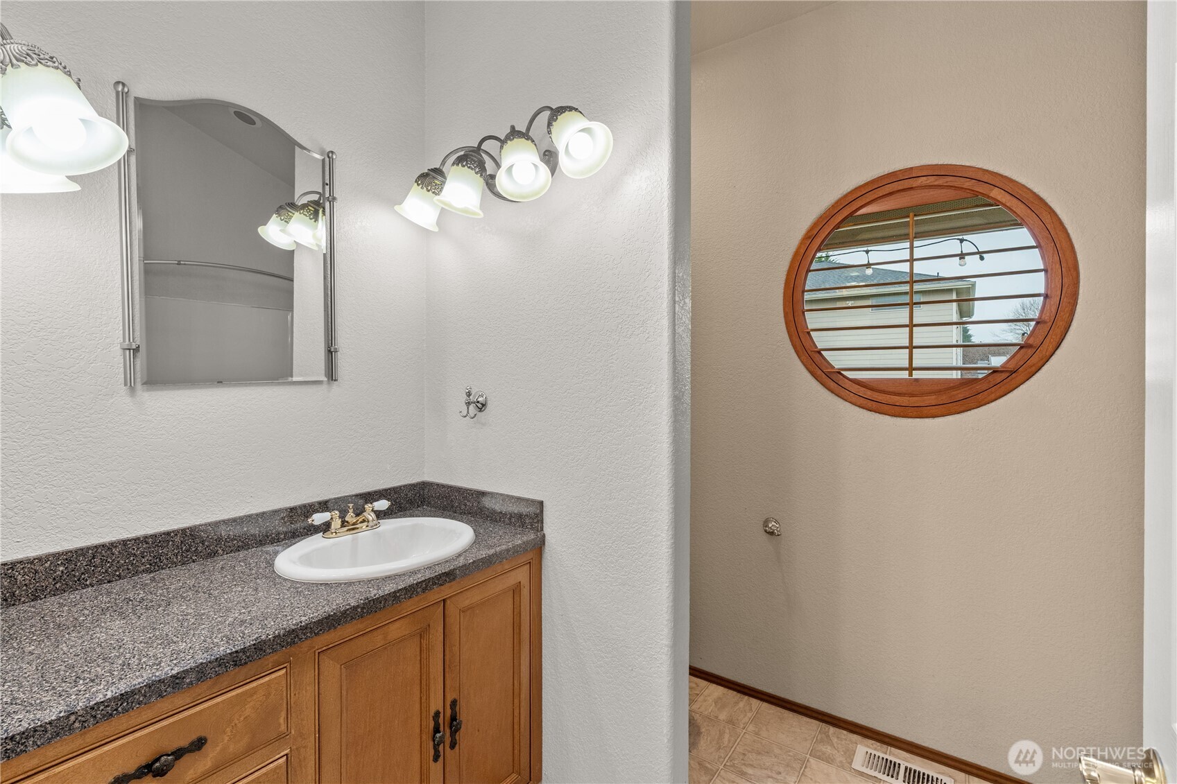 100 9th Street South Montesano, WA 98563 - Photo 17 of 40 a bathroom with a sink and a mirror