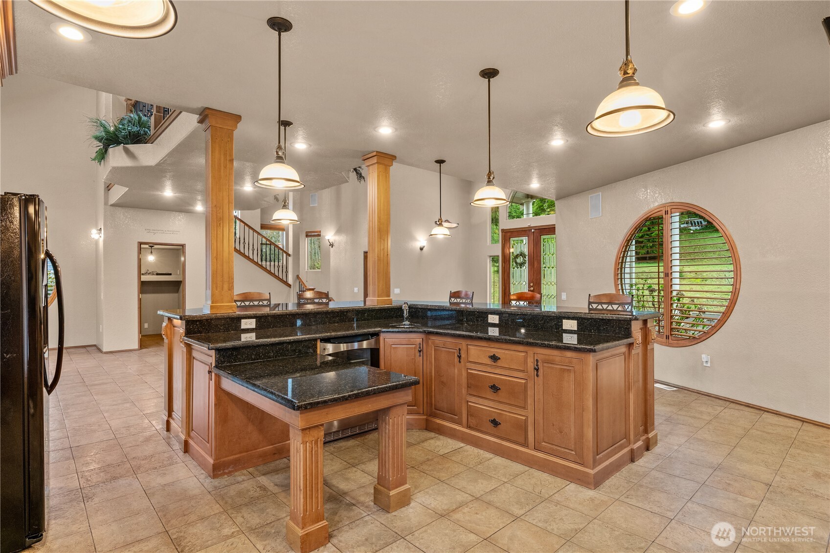 100 9th Street South Montesano, WA 98563 - Photo 8 of 40 a kitchen with stainless steel appliances granite countertop a stove a sink a refrigerator and a wooden floor