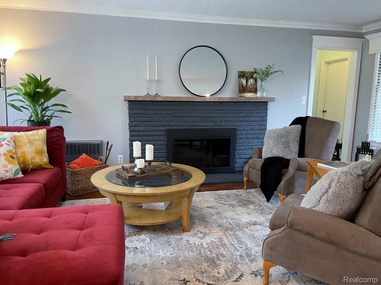 929 Main Street Fenton, MI 48430 - Photo 7 of 28 Bright living room with beautiful brick fireplace.