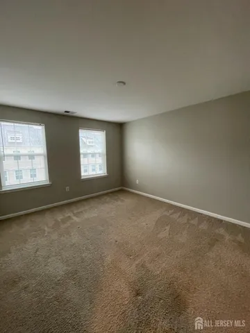 a view of an empty room and a window