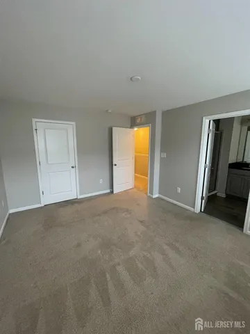 a bathroom with a glass door shower