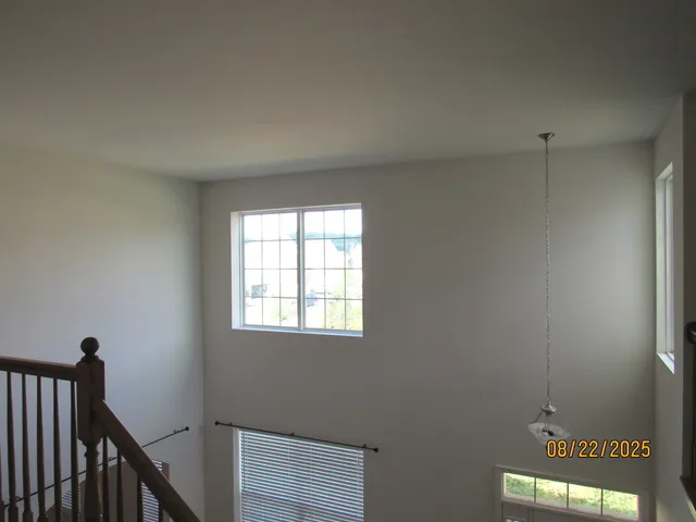 a view of a hallway with a window