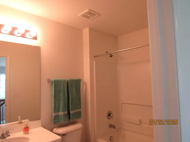 a bathroom with a shower and a sink
