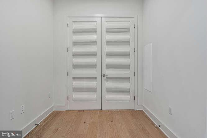 6803 Cameron Drive Northwest, Unit 314 Washington, DC 20012 - Photo 20 of 25 wooden floor in an empty room