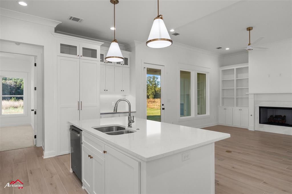 35 Turtle Creek Drive Benton, LA 71006 - Photo 16 of 32 a kitchen with a sink chandelier and living room view
