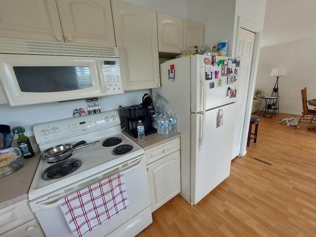 1000 Southwest 44th Boulevard Okeechobee, FL 34974 - Photo 7 of 11 a white refrigerator freezer sitting inside of a kitchen
