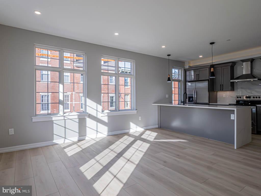 769 South 10th Street, Unit 3D Philadelphia, PA 19147 - Photo 4 of 9 a view of kitchen with window and wooden floor