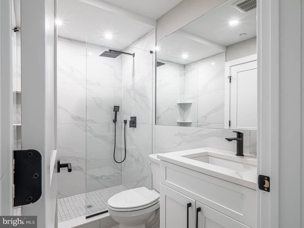 769 South 10th Street, Unit 3D Philadelphia, PA 19147 - Photo 7 of 9 a bathroom with a shower a toilet and sink