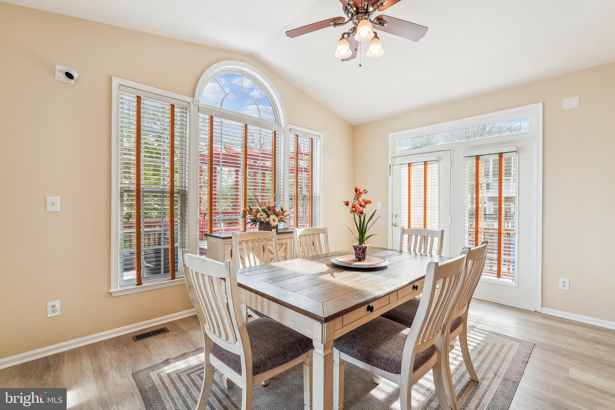 42801 Ridgeway Drive Broadlands, VA 20148 - Photo 11 of 40 a view of a dining room with furniture window and wooden floor