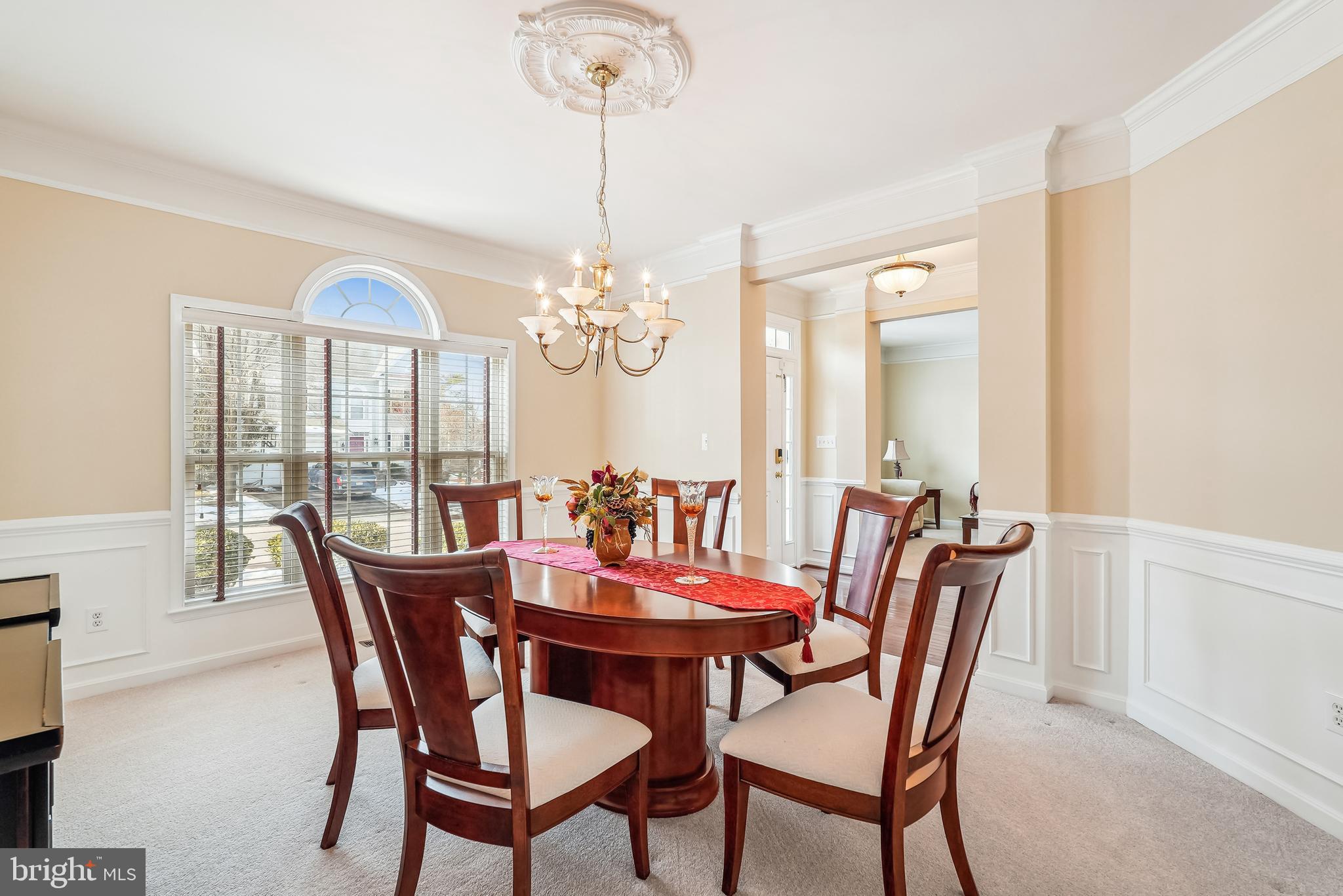 42801 Ridgeway Drive Broadlands, VA 20148 - Photo 15 of 40 a view of a dining room with furniture a chandelier and wooden floor