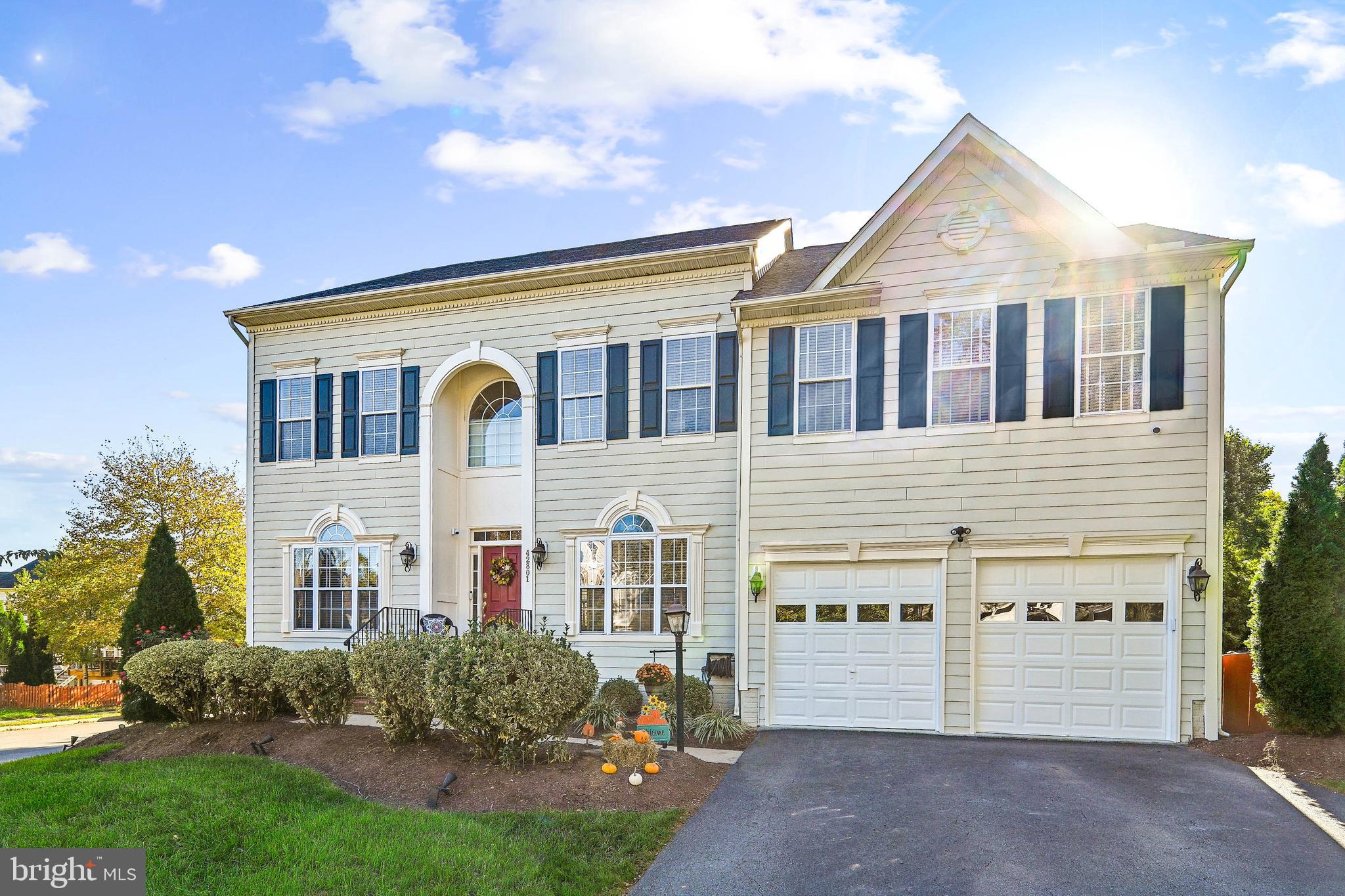 42801 Ridgeway Drive Broadlands, VA 20148 - Photo 2 of 40 a front view of a house with a yard