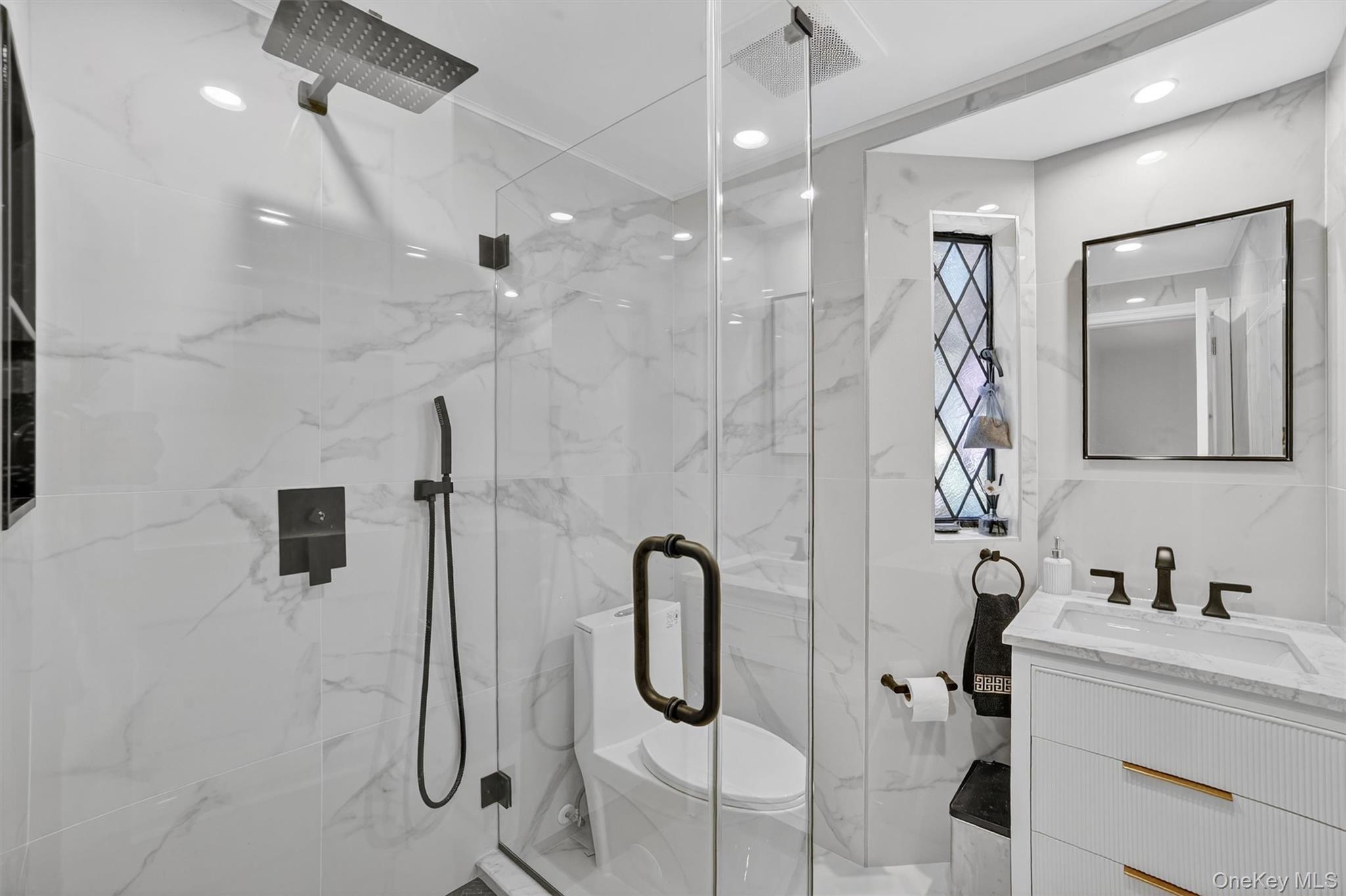 20 Whistler Road Scarsdale, NY 10583 - Photo 20 of 47 a bathroom with a bathtub shower sink and mirror