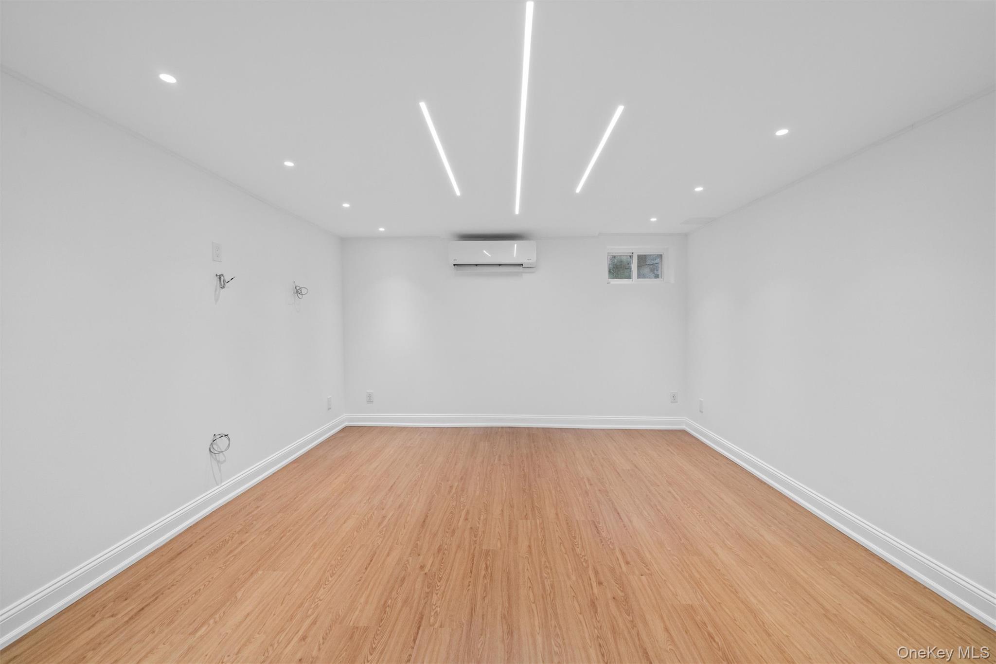 20 Whistler Road Scarsdale, NY 10583 - Photo 37 of 47 a view of a big room with wooden floor and windows