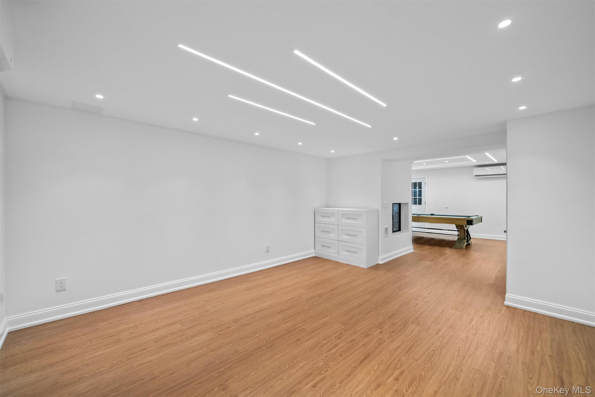 20 Whistler Road Scarsdale, NY 10583 - Photo 38 of 47 a view of empty room with wooden floor and fireplace