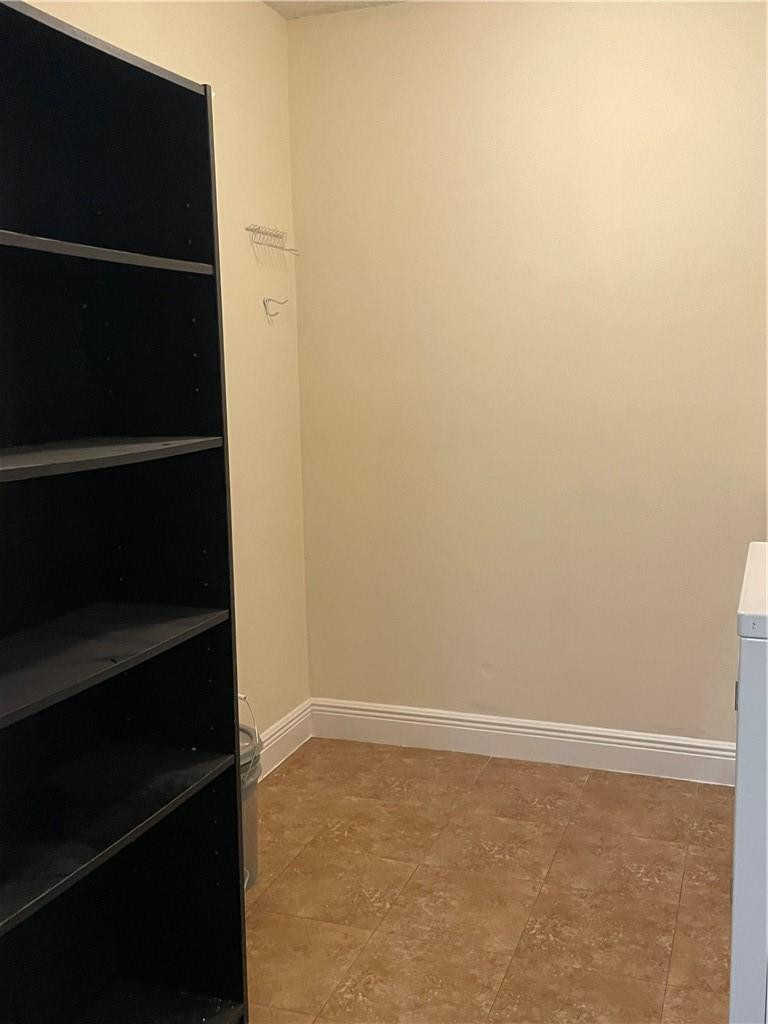 5686 Rock Island Road, Unit 130 Tamarac, FL 33319 - Photo 9 of 23 a view of an empty walk in closet