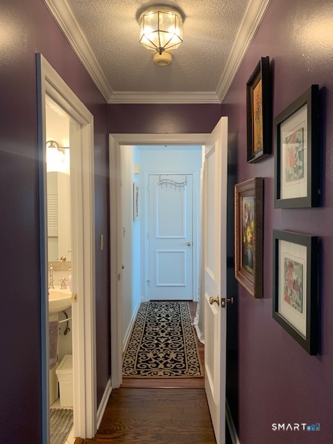 200 Brittany Farms Road, Unit D New Britain, CT 06053 - Photo 11 of 36 a view of hallway with a large window and chandelier