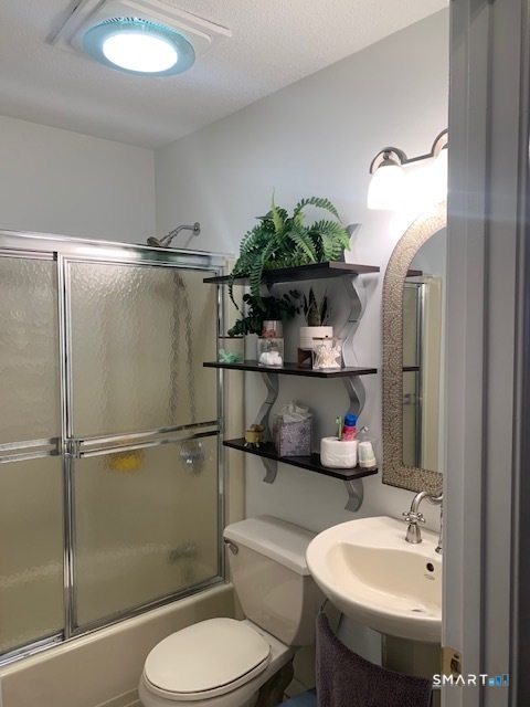 200 Brittany Farms Road, Unit D New Britain, CT 06053 - Photo 13 of 36 a bathroom with a sink toilet and shower