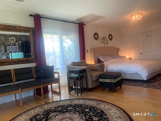 200 Brittany Farms Road, Unit D New Britain, CT 06053 - Photo 19 of 36 a bedroom with furniture and a window