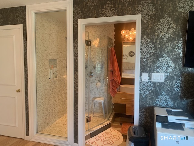 200 Brittany Farms Road, Unit D New Britain, CT 06053 - Photo 20 of 36 a bathroom with a glass shower door