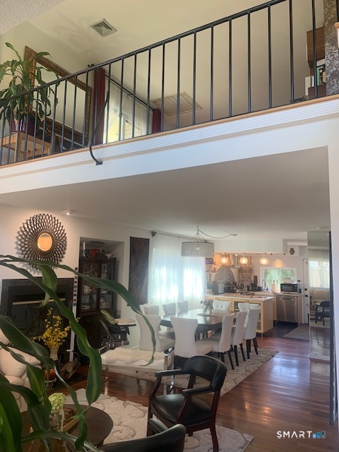 200 Brittany Farms Road, Unit D New Britain, CT 06053 - Photo 2 of 36 a living room with lots of furniture and a chandelier