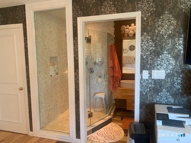 200 Brittany Farms Road, Unit D New Britain, CT 06053 - Photo 21 of 36 a bathroom with a glass shower door