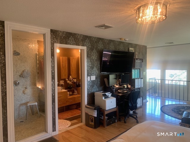200 Brittany Farms Road, Unit D New Britain, CT 06053 - Photo 22 of 36 a living room with furniture and a flat screen tv