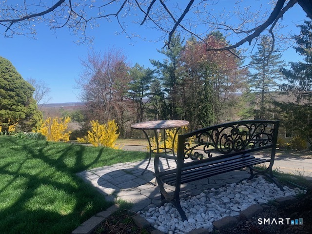 200 Brittany Farms Road, Unit D New Britain, CT 06053 - Photo 29 of 36 a bench sitting in the middle of a yard