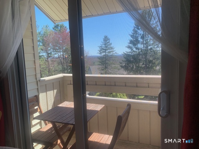 200 Brittany Farms Road, Unit D New Britain, CT 06053 - Photo 30 of 36 a view of a balcony with chair