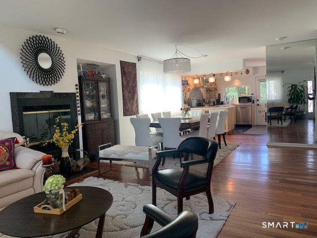 200 Brittany Farms Road, Unit D New Britain, CT 06053 - Photo 3 of 36 a view of a dining room with furniture window and wooden floor