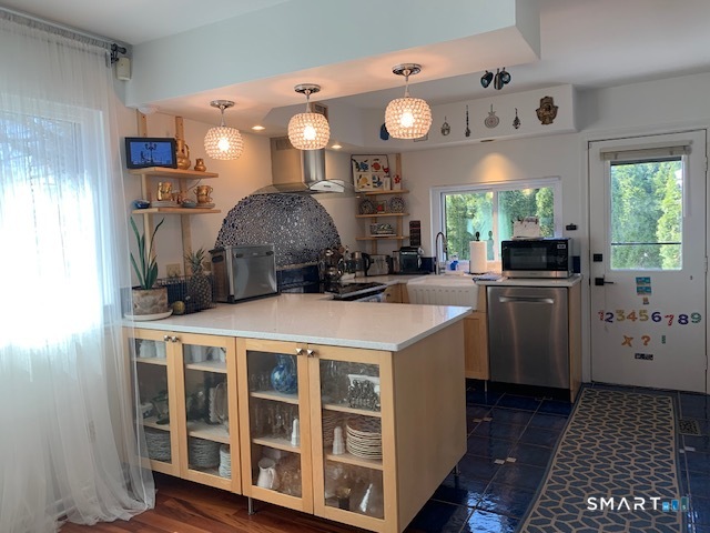 200 Brittany Farms Road, Unit D New Britain, CT 06053 - Photo 5 of 36 a kitchen with a stove and a refrigerator