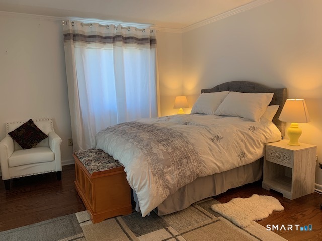 200 Brittany Farms Road, Unit D New Britain, CT 06053 - Photo 10 of 36 a bedroom with a bed and a couch