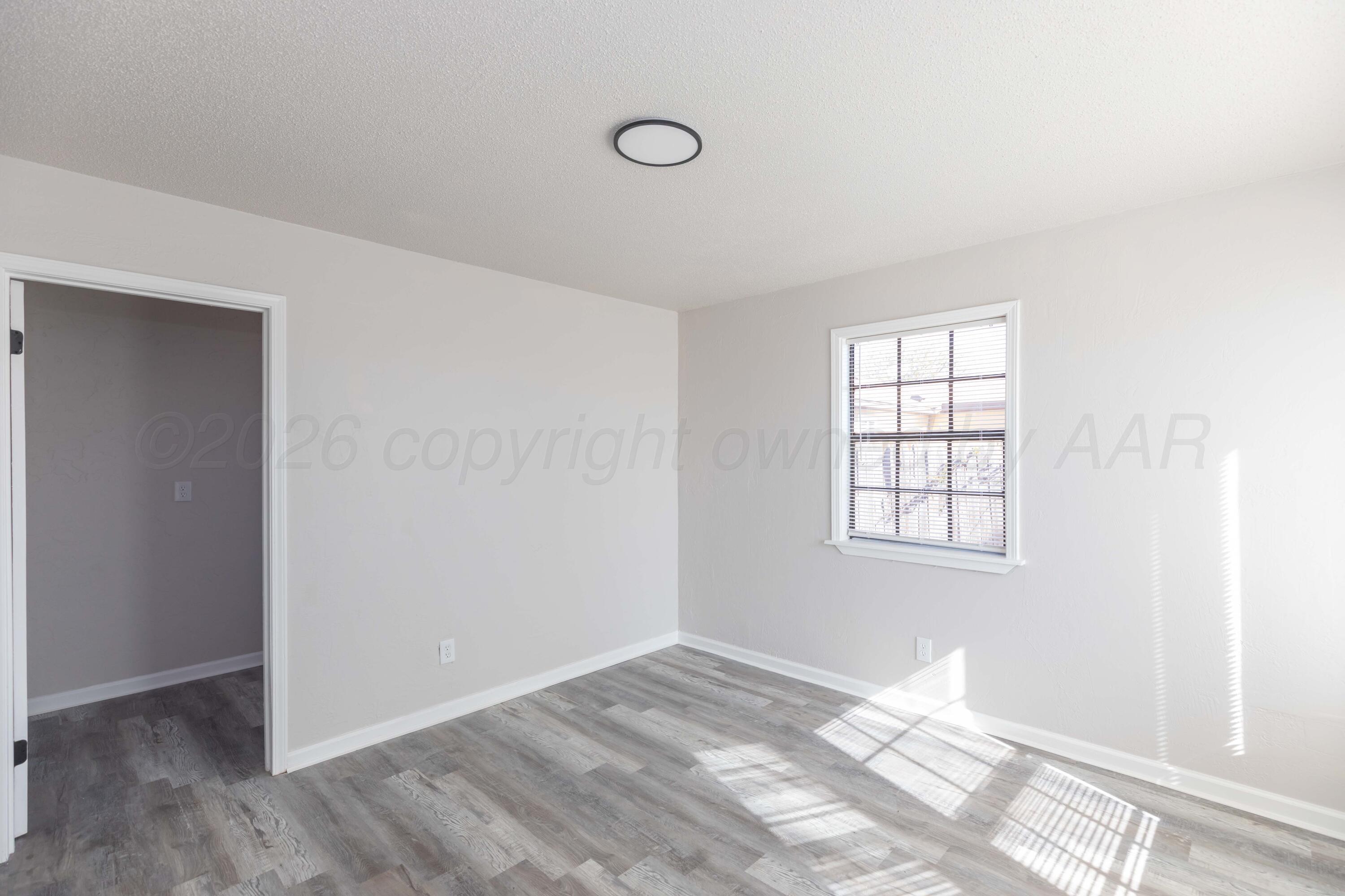2915 Hodges Street Amarillo, TX 79103 - Photo 11 of 34 an empty room with windows