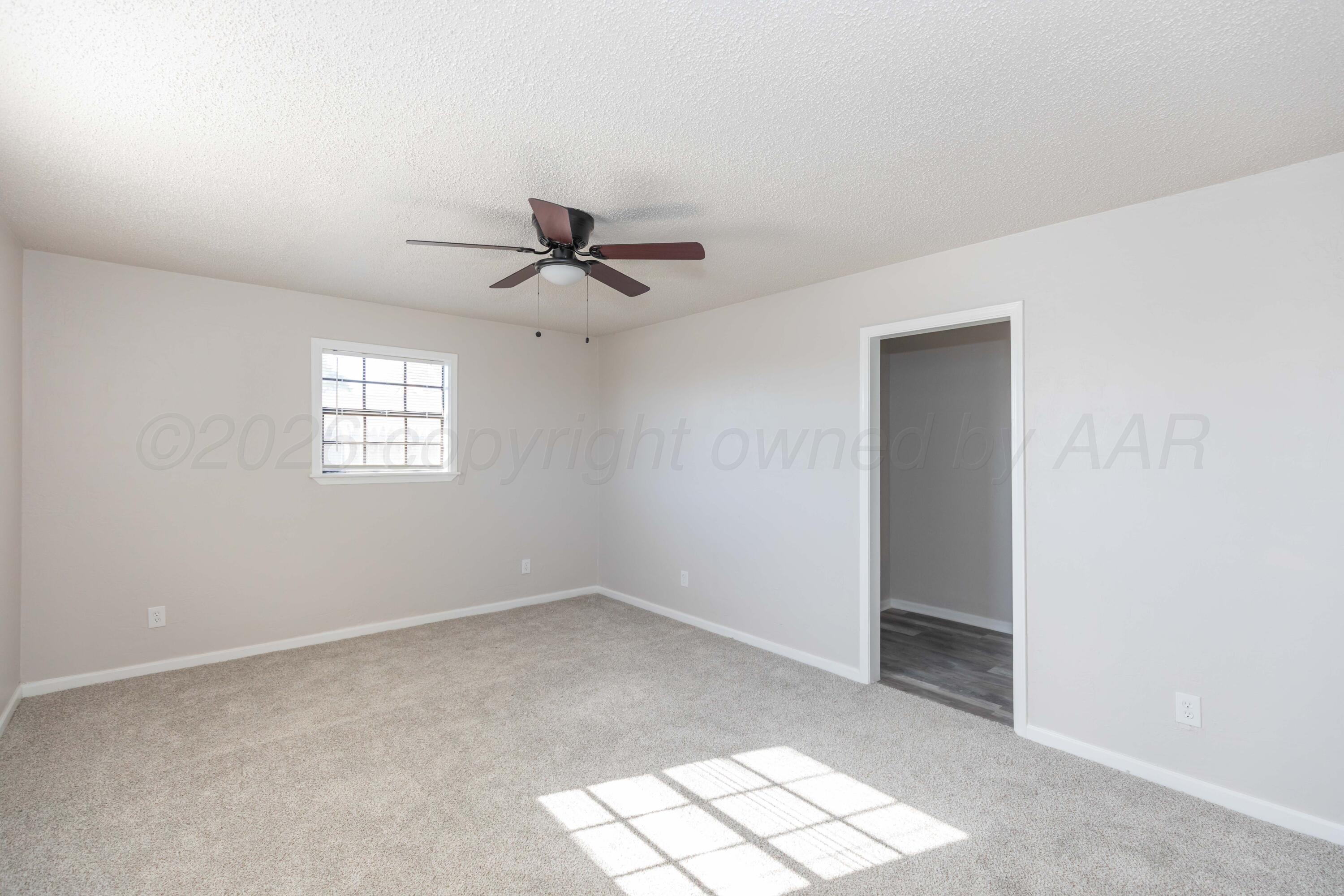 2915 Hodges Street Amarillo, TX 79103 - Photo 20 of 34 a view of an empty room with a window