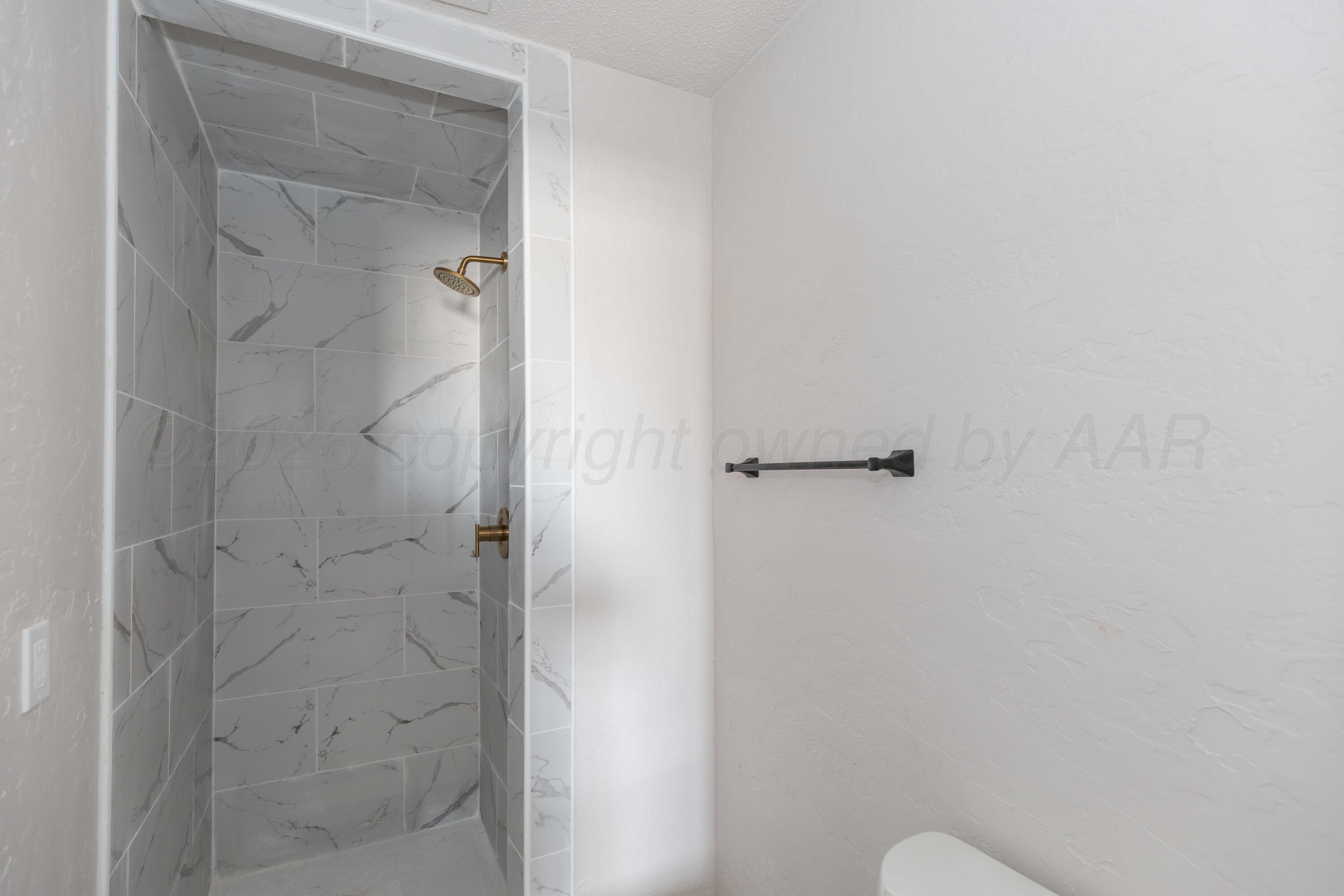 2915 Hodges Street Amarillo, TX 79103 - Photo 23 of 34 a bathroom with a shower