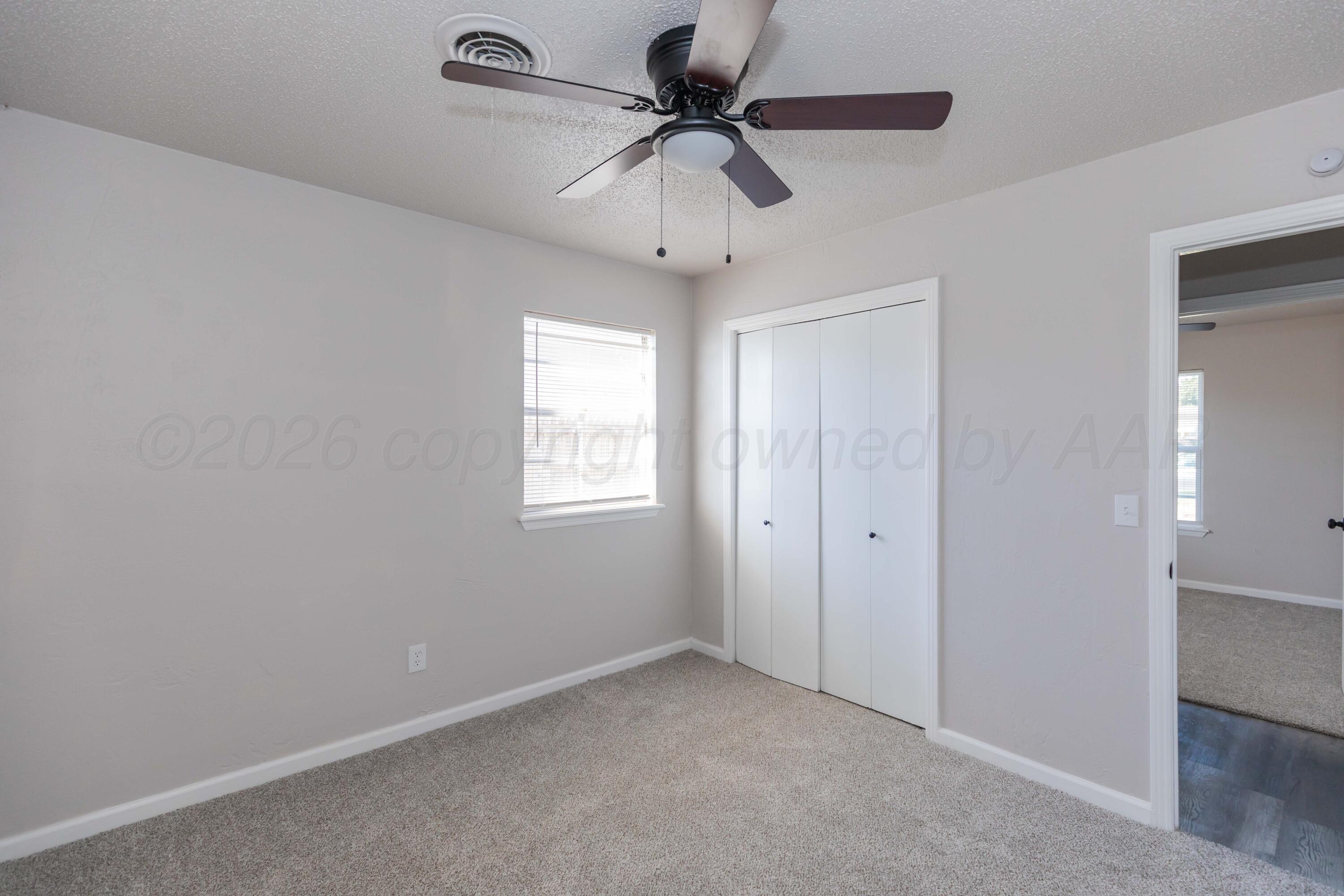 2915 Hodges Street Amarillo, TX 79103 - Photo 31 of 34 a view of an empty room with a ceiling fan