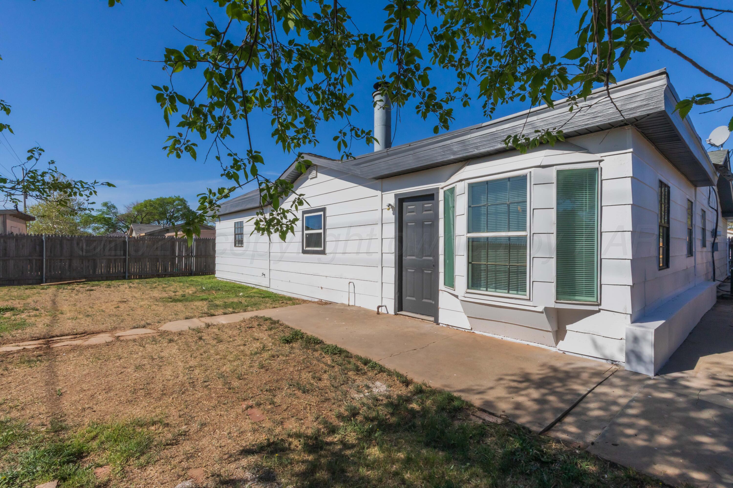 2915 Hodges Street Amarillo, TX 79103 - Photo 33 of 34 a front view of a house with a yard