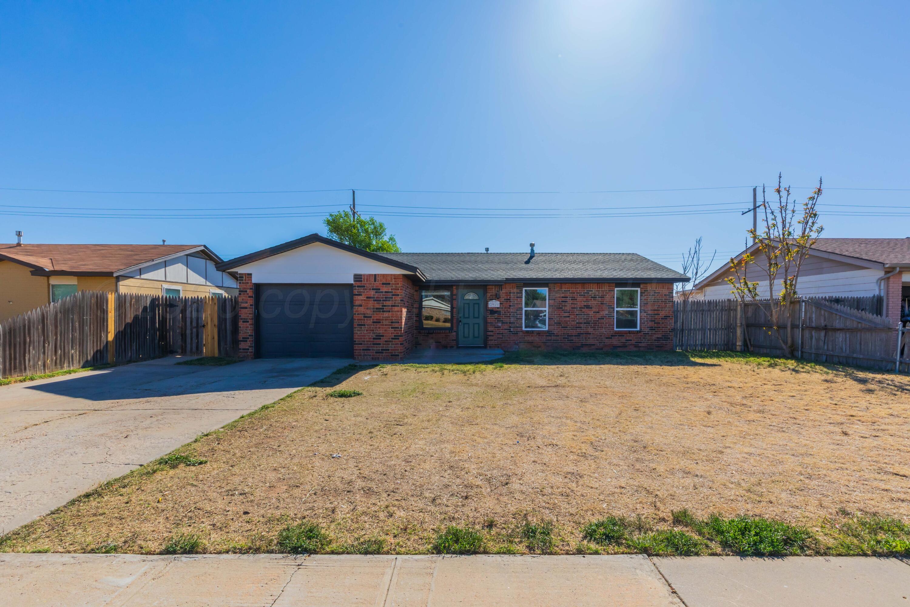 2915 Hodges Street Amarillo, TX 79103 - Photo 34 of 34 a front view of a house with a yard